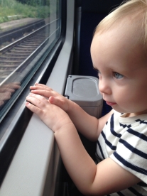 Watching for trains out the window on a train.